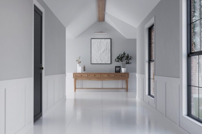 A modern and spacious residential corridor with bright white porcelain tile flooring